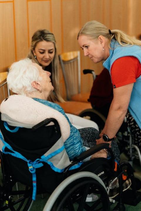 A caregiver working with an elderly person. 