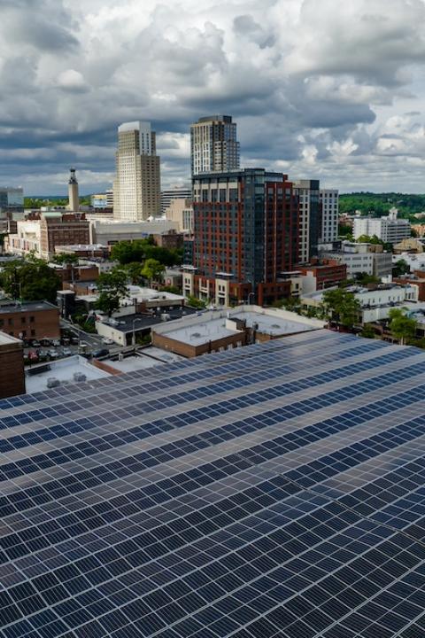 Solar panels on a building in a city — green skills