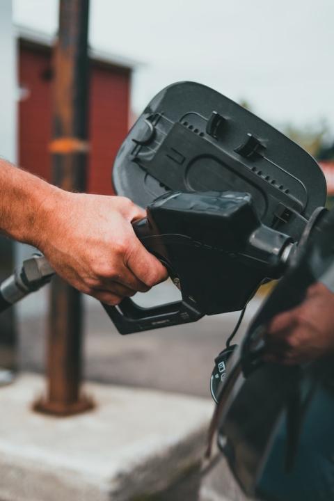 Person Pumping Gas - Gas Station
