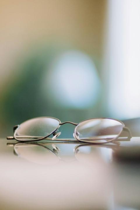 Reading glasses on a table — VisionSpring