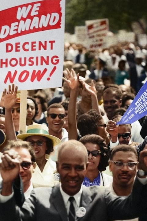 demonstrators attend the 1963 March on Washington - one sign reads 'we demand decent housing now' 