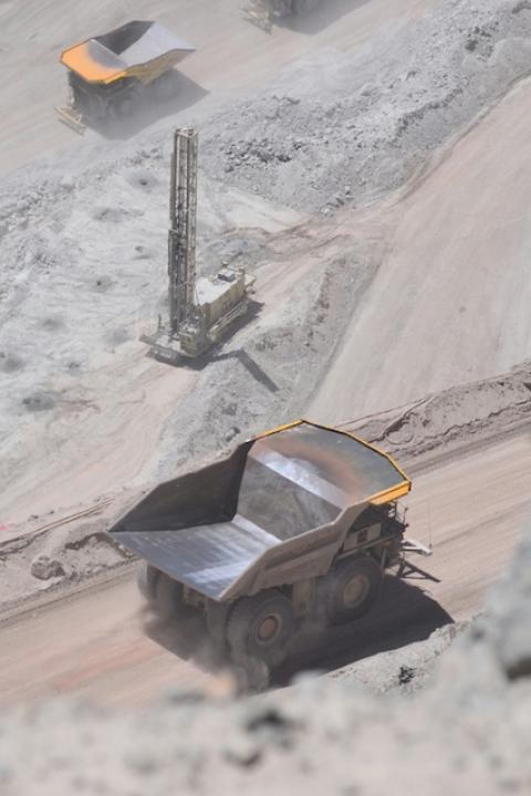 Dump trucks at the Chuquicamata mine in Chile — mining taxes