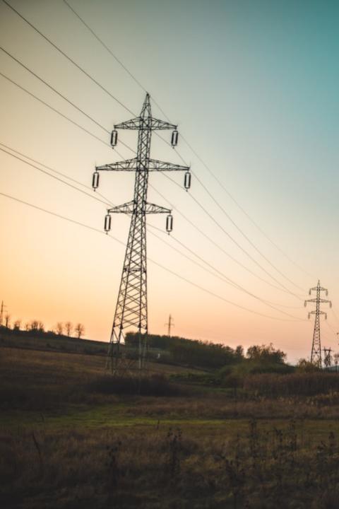 power lines at sunset - decarbonizing the energy grid to fight climate change