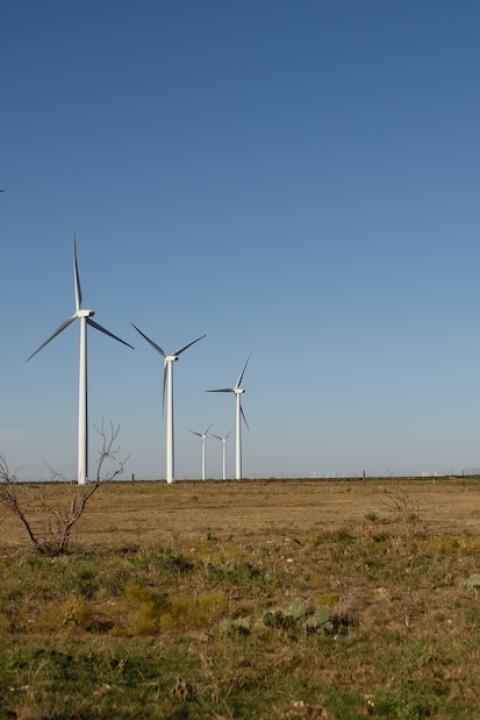 wind turbines and oil pump side by side in texas — renewable energy in texas