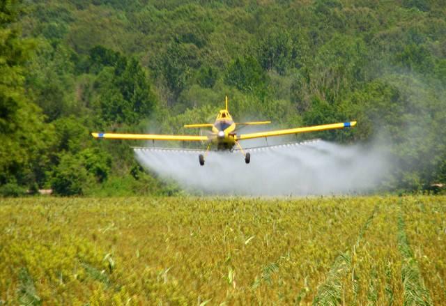 A-crop-duster-spraying-a-field-in-Mississippi.jpg