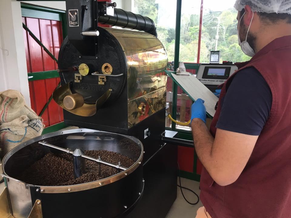A-worker-checks-the-progress-of-beans-being-roasted-at-a-hacienda-just-outside-Salento-Colombia.jpg