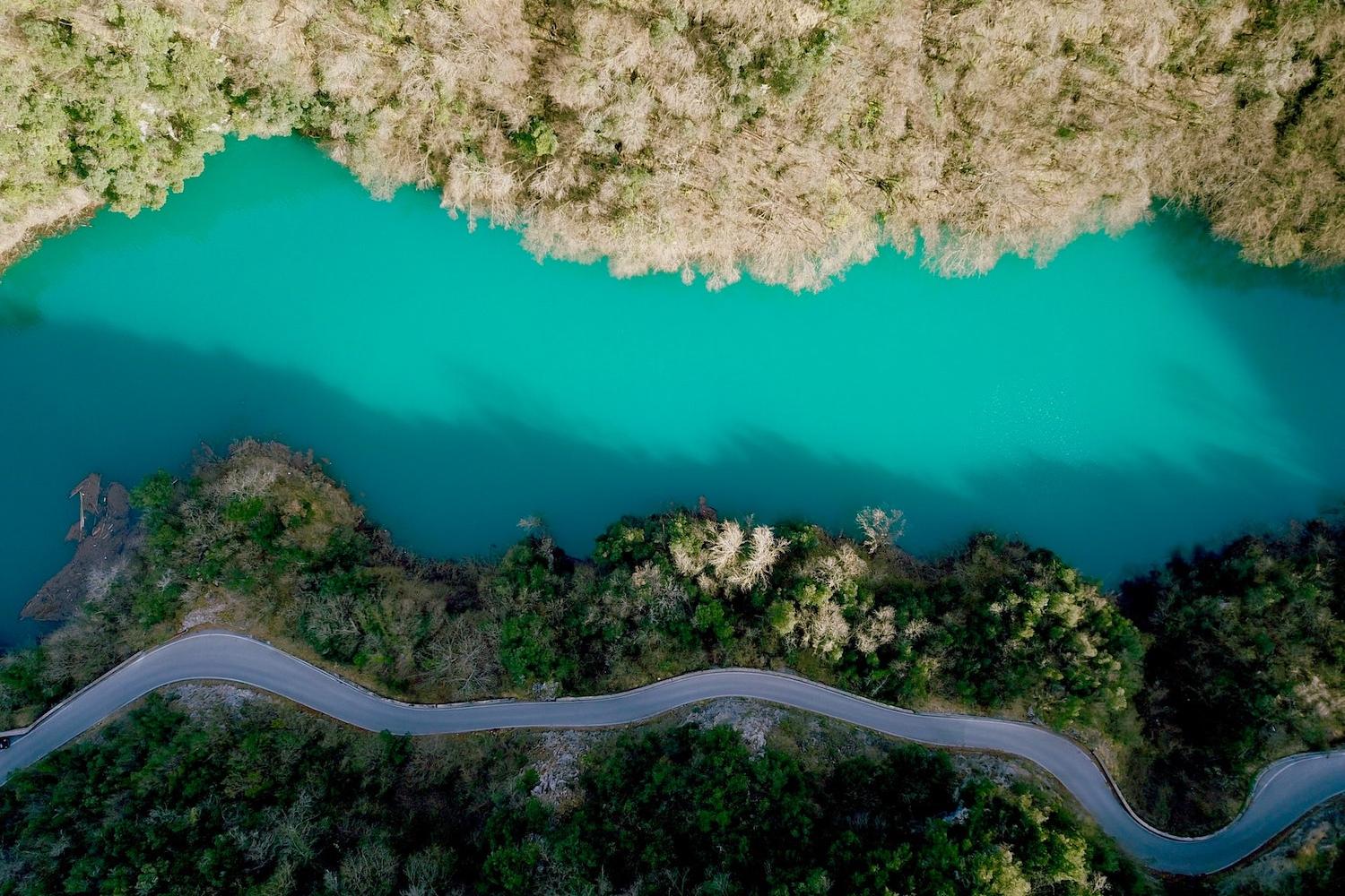 Water - Aerial shot of river forest and rural highway