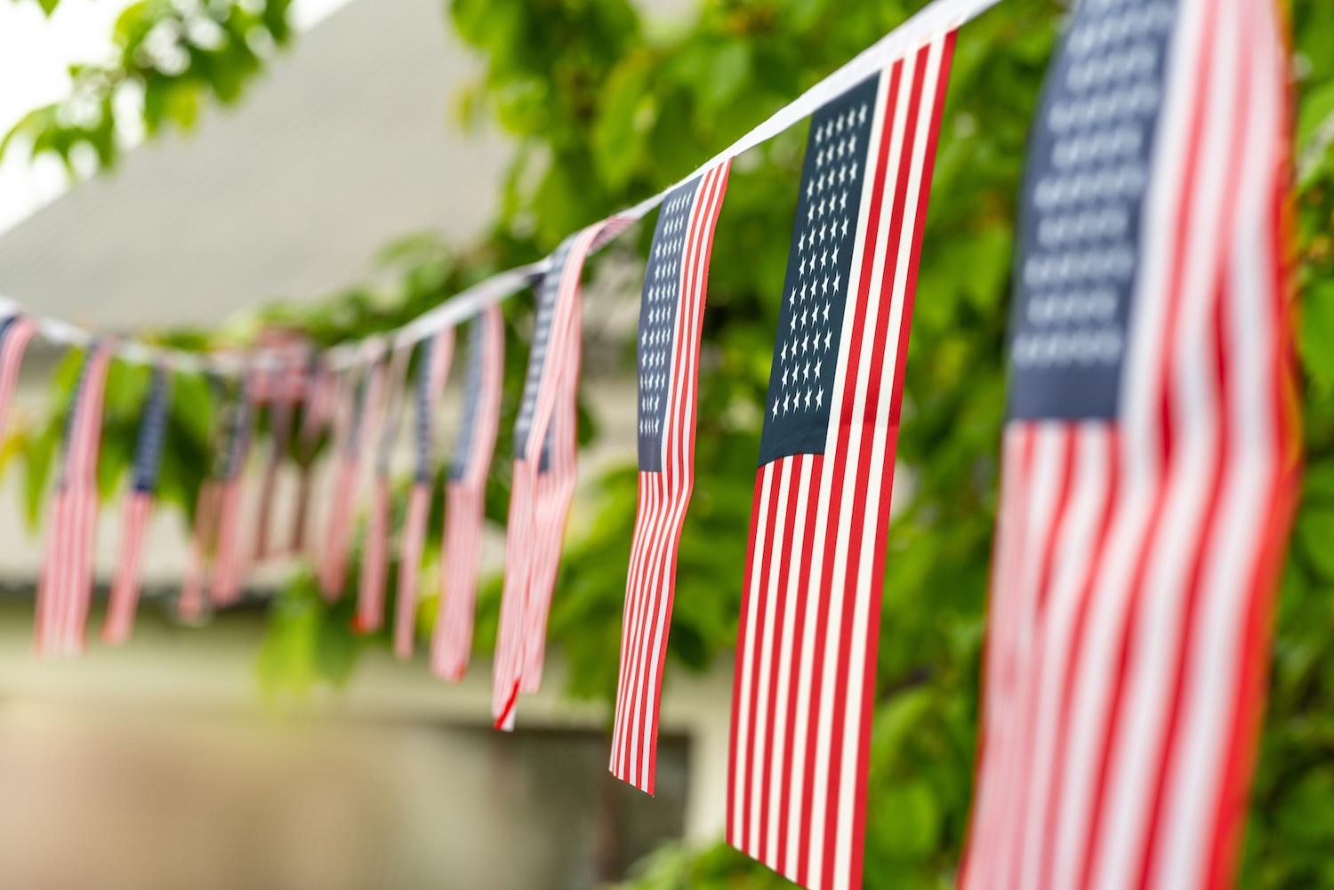 American flag bunting hanging in a yard for the Fourth of July — how employee-owned companies embrace independence