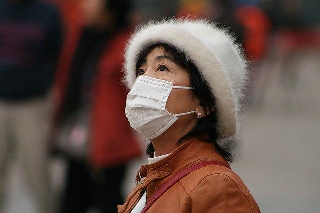 Chinese-woman-wearing-face-mask.jpg
