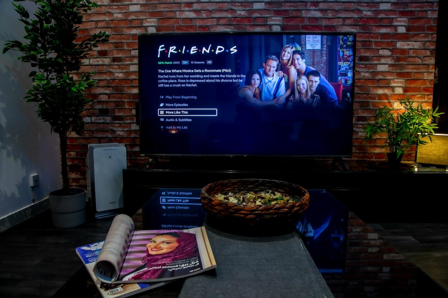 Friends streaming on Netflix on a TV in a living room