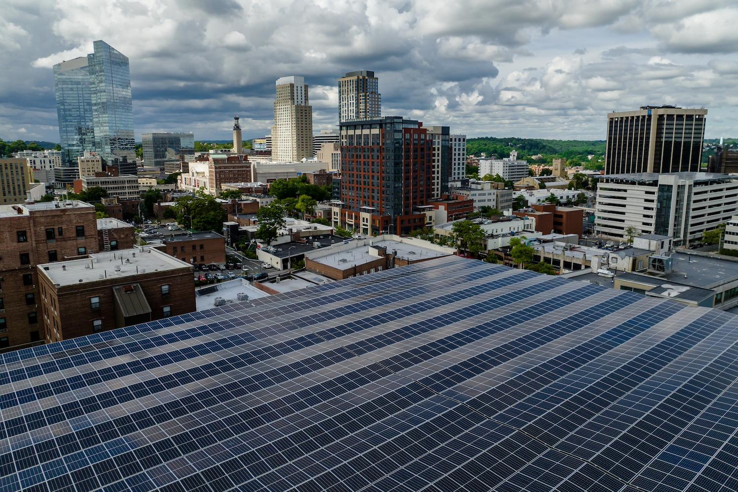 Solar panels on a building in a city — green skills