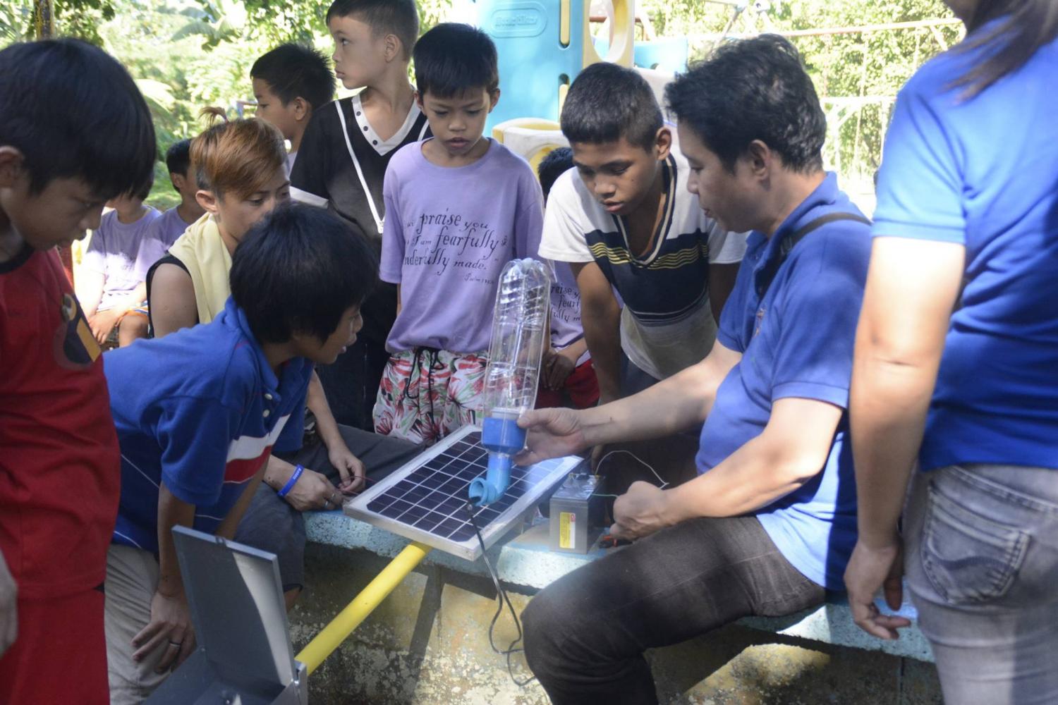 Liter-of-Light-is-now-training-citizens-to-assemble-solar-powered-street-lamps.jpg