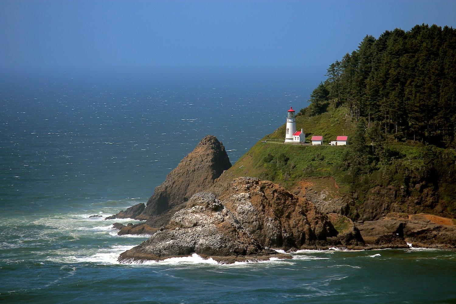 A red and white lighthouse near the Pacific Ocean — ocean protection