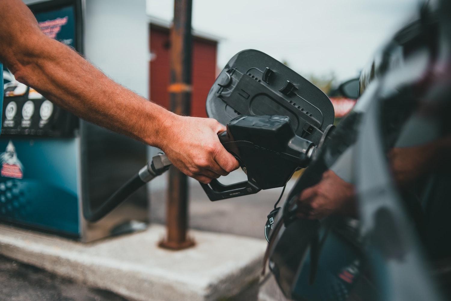 Person Pumping Gas - Gas Station