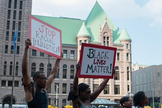 Protesters-at-a-rally-in-response-to-the-George-Zimmerman-verdict-in-Minneapolis-July-2013.jpg