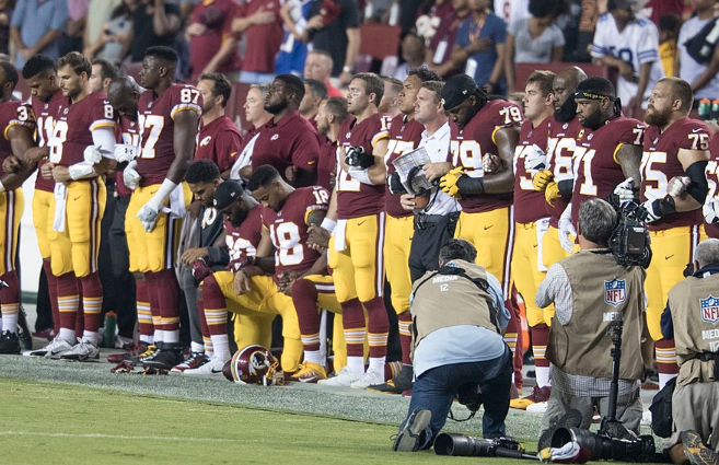 Washington-Redskins-players-kneeling-before-Sunday-nights-game-against-the-Oakland-Raiders.png