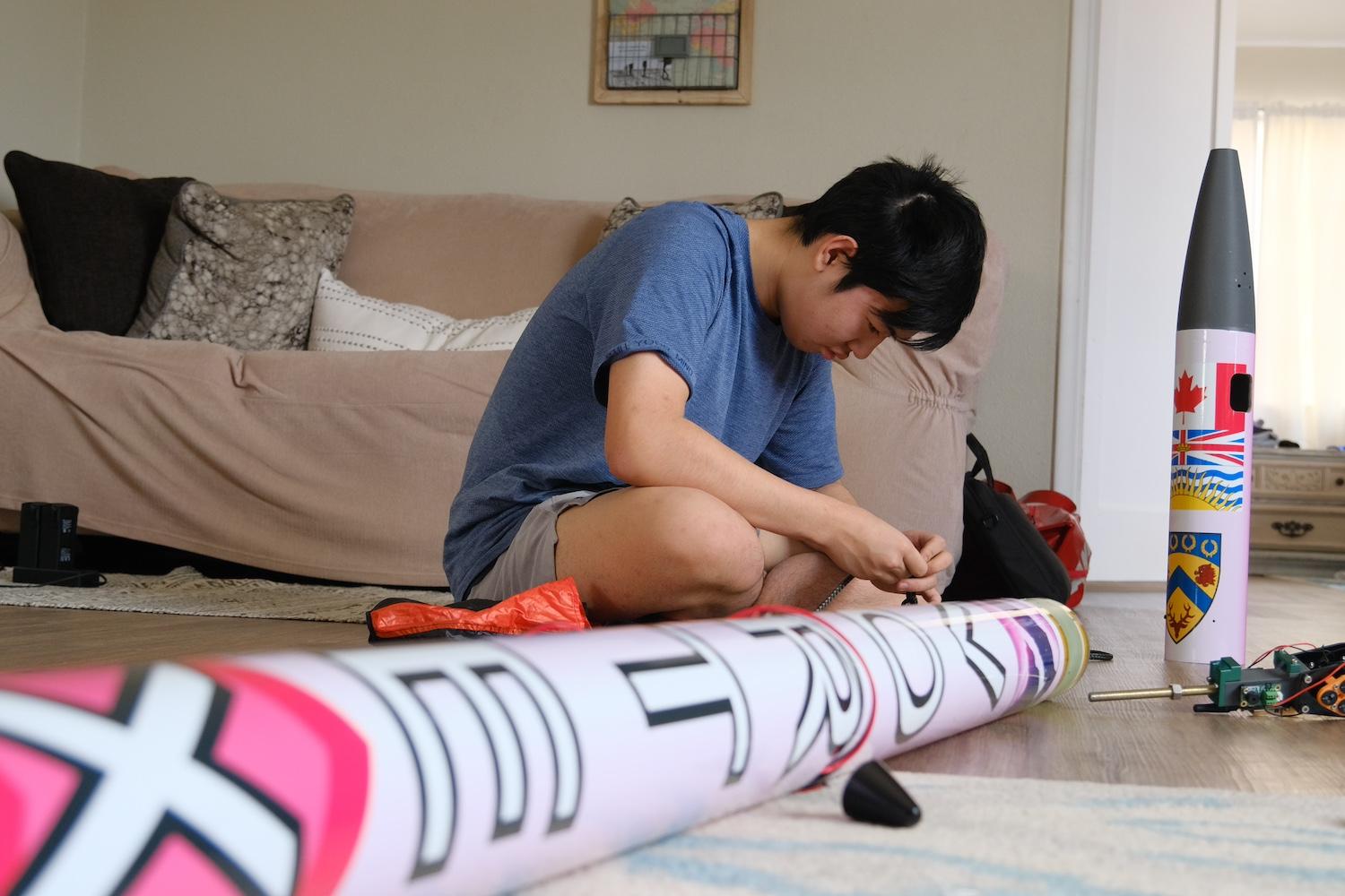 Jason Zhao working on the rocket he designed to detect and monitor a wildfires 