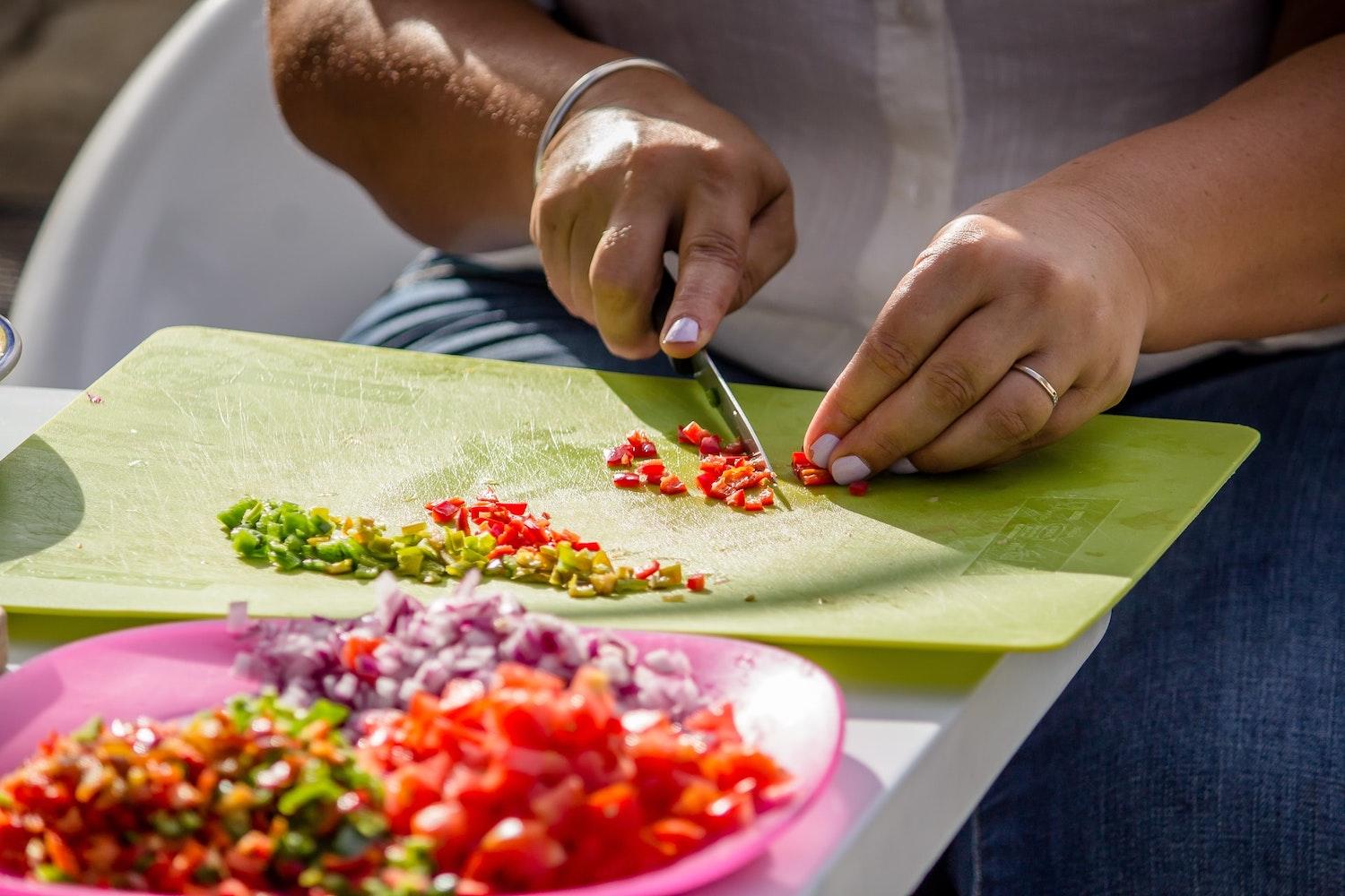 Woman Preparing a Healthy Meal - Fight Hunger and Improve Nutrition