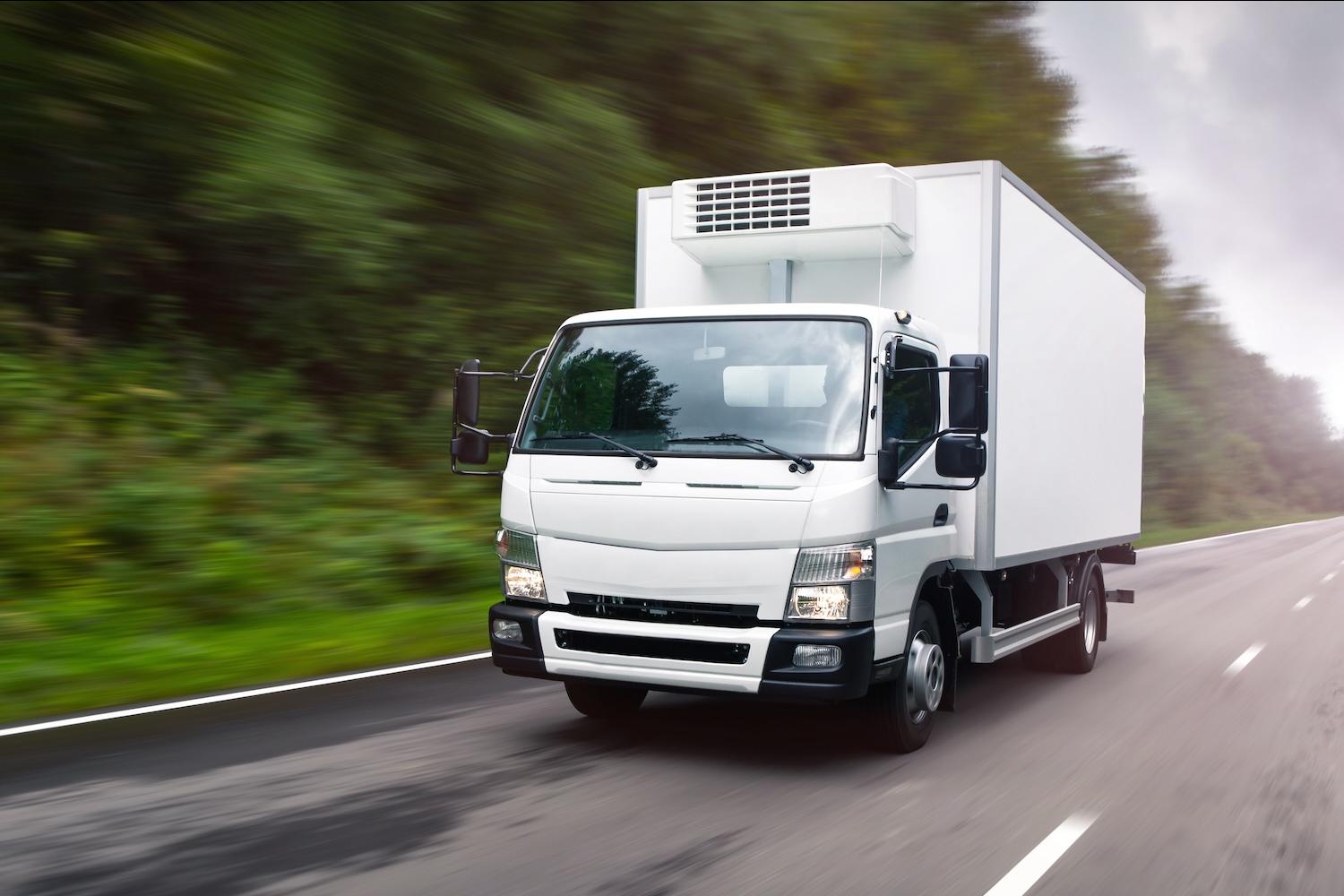 box truck on highway with trees in background - fueling for fleets