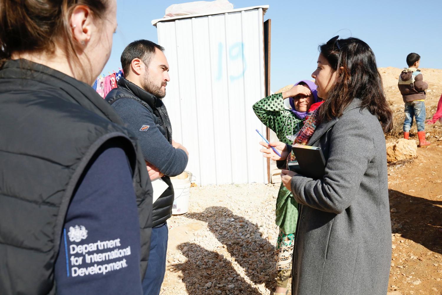 Humanitarian advisers from the U.K's Department for International Development talk to Syrian refugees in the Bekaa Valley, Lebanon, February 2017.