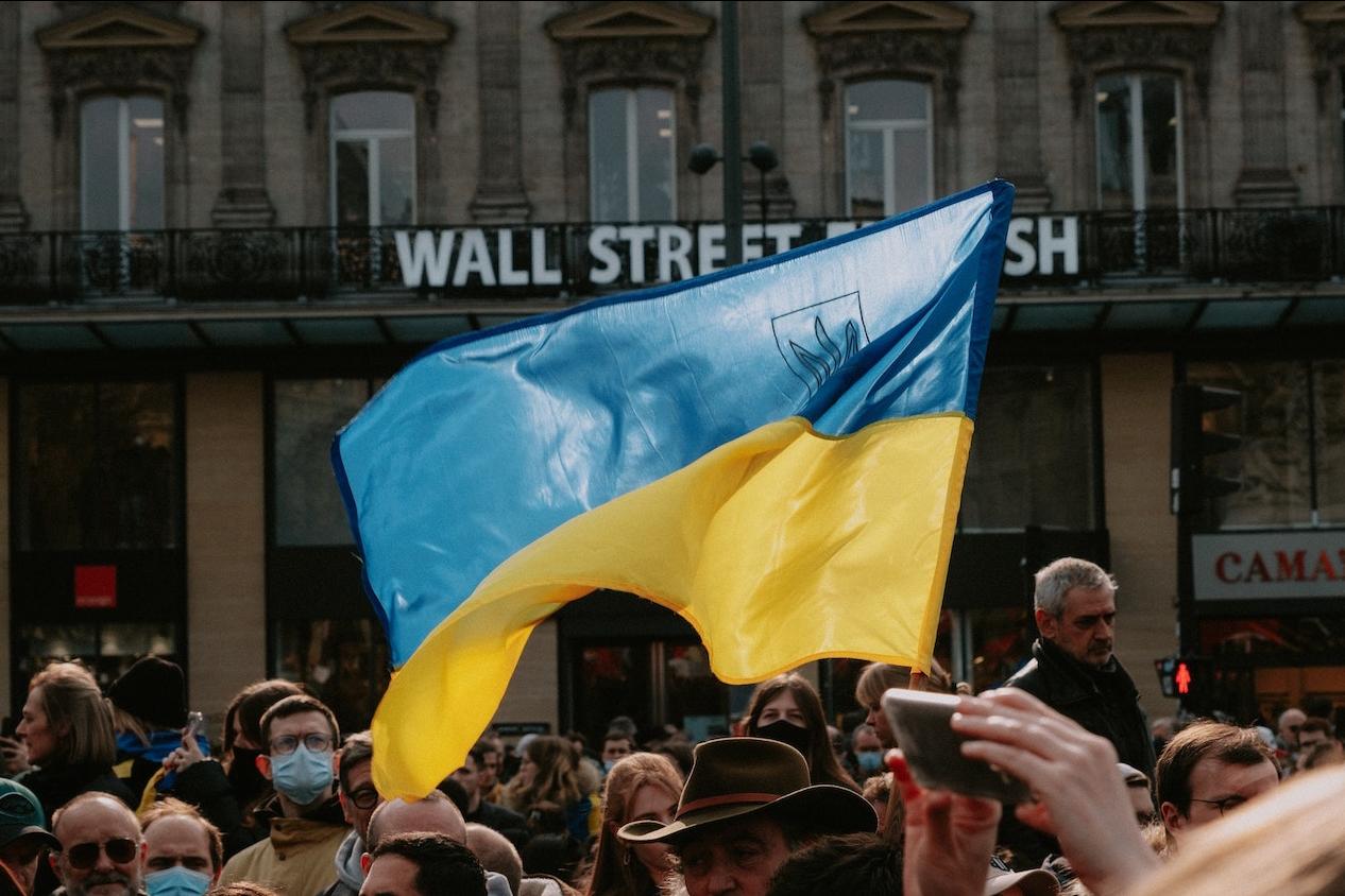 demonstrators hold ukrainian flag in support of ukraine amidst russian war