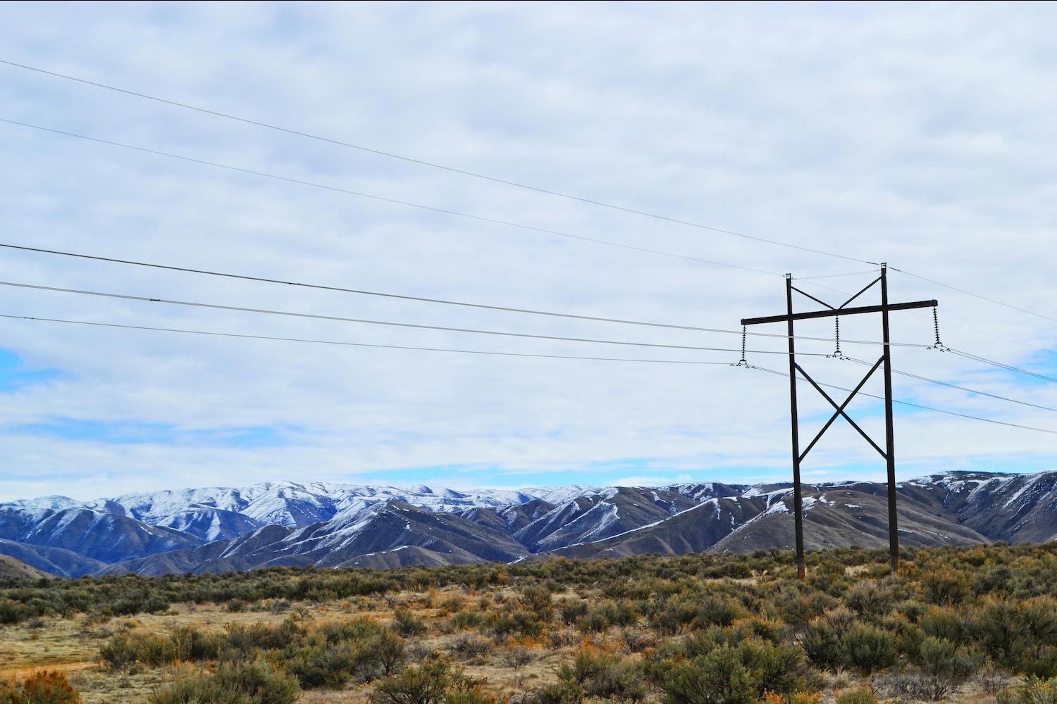 Power lines in front of mountains — electricity demand