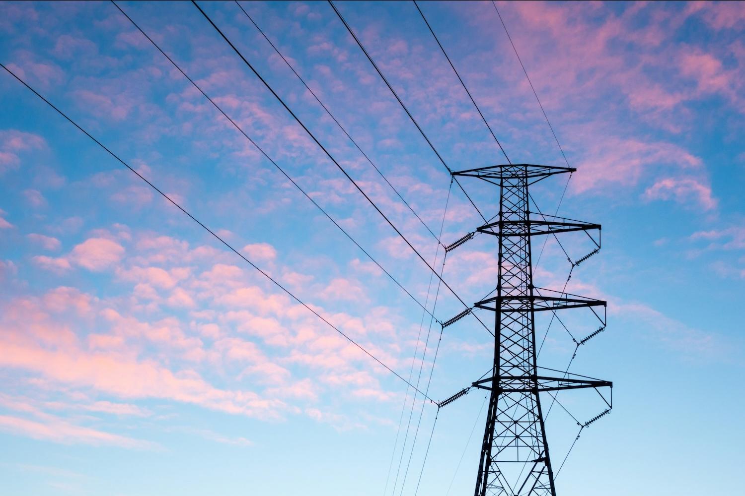 energy transmission lines at sunset