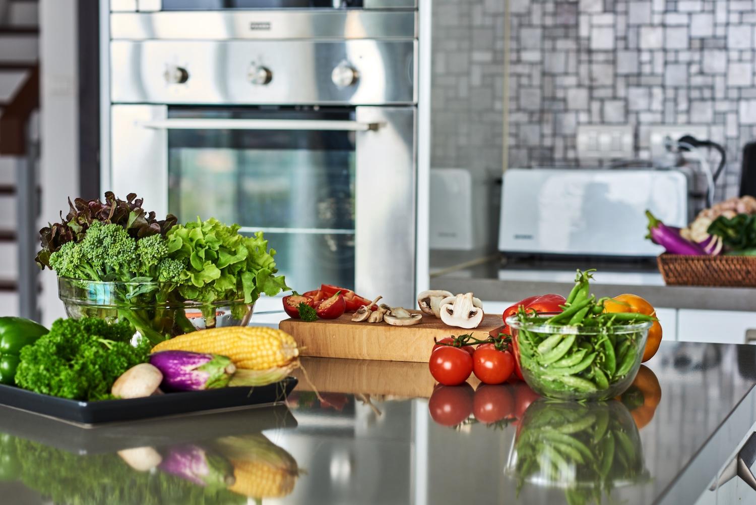 fruits and vegetables on kitchen counter - how to store fruits and vegetables so they last longer