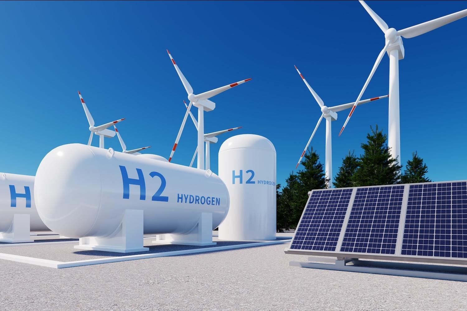 A rendering of a hydrogen storage tank near wind turbines and solar panels — green hydrogen