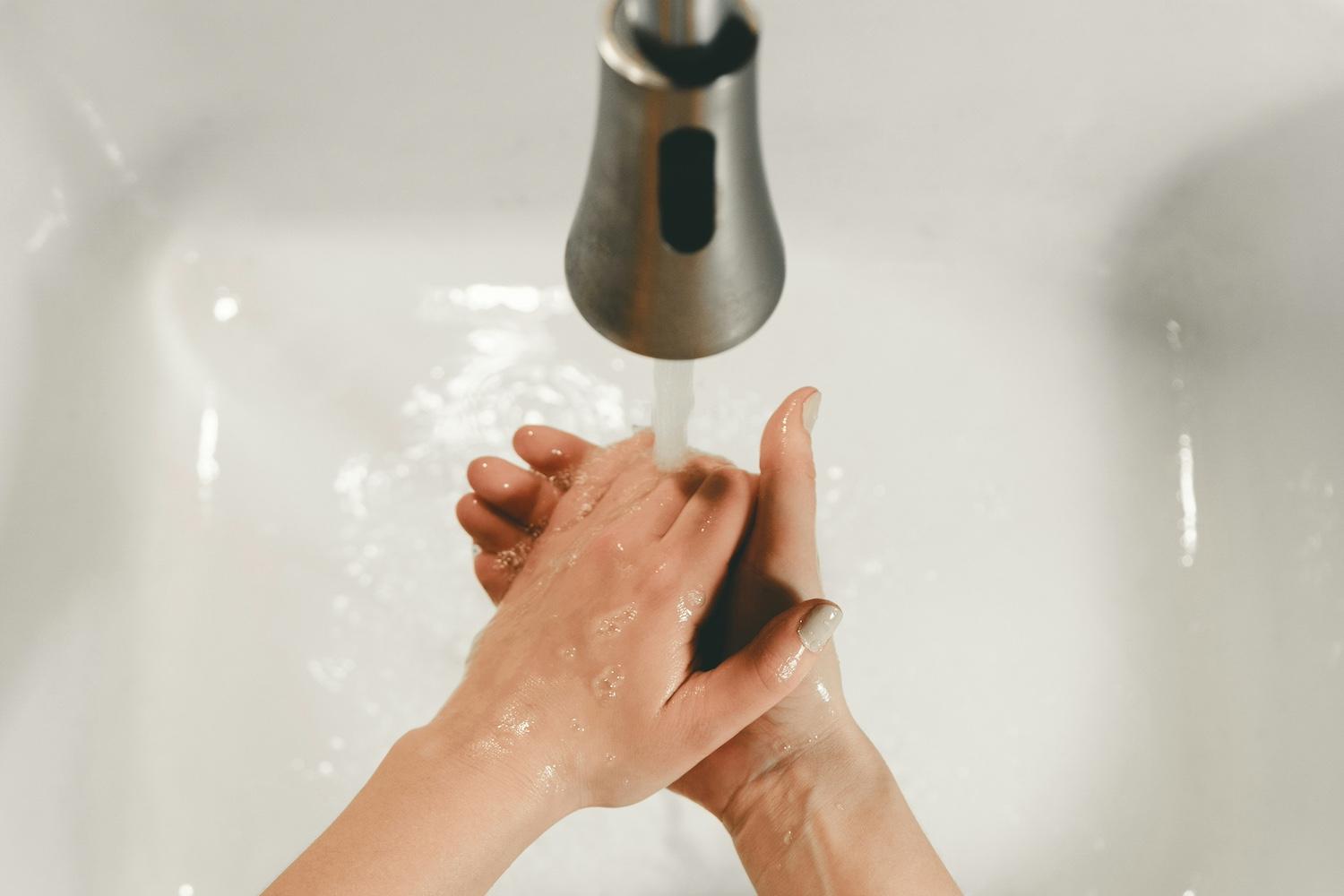 A person washing their hands — Female Founders