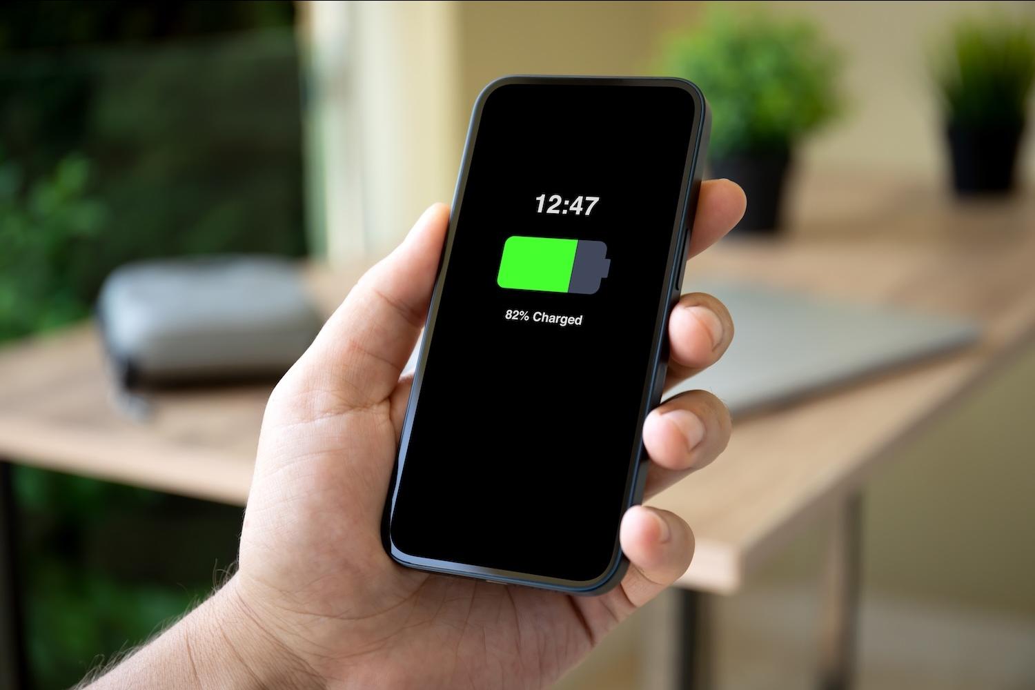 A smart phone screen displays an "82 percent charged" message — Liion Power