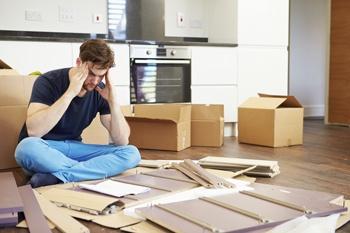 man_putting_together_furniture_iStock_000031263990XXLarge.jpg