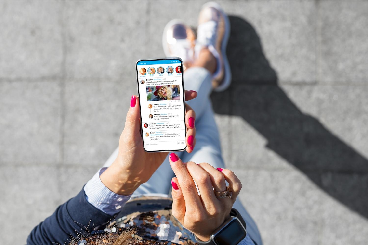 person reading news app — news avoidance — sustainability news