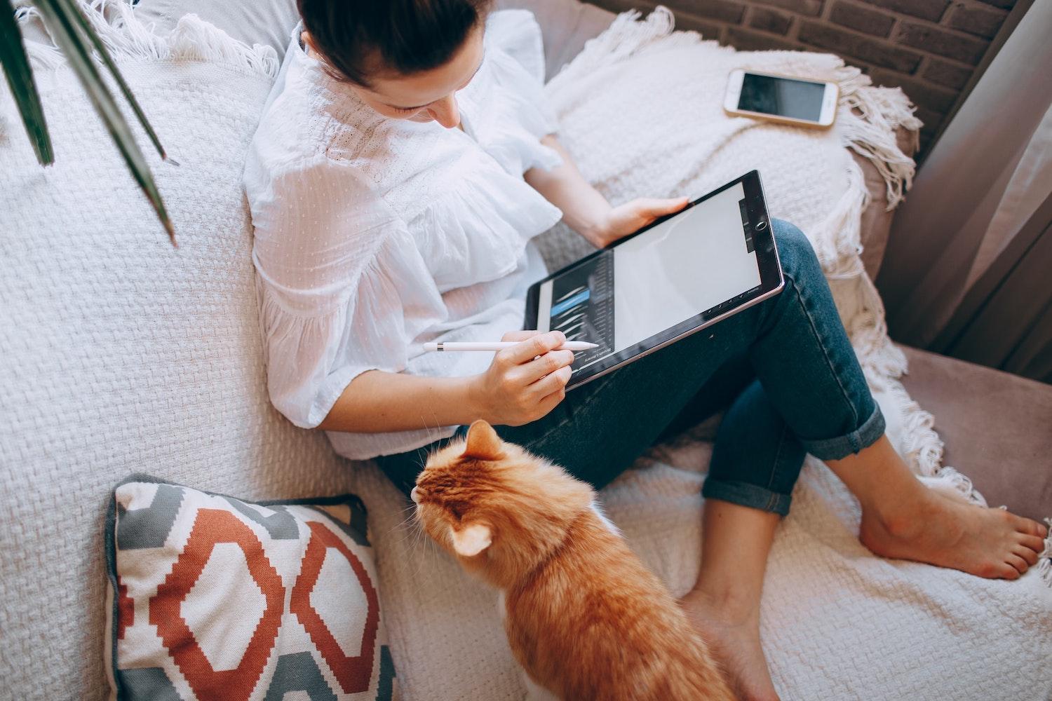 remote work - woman working from home with cat