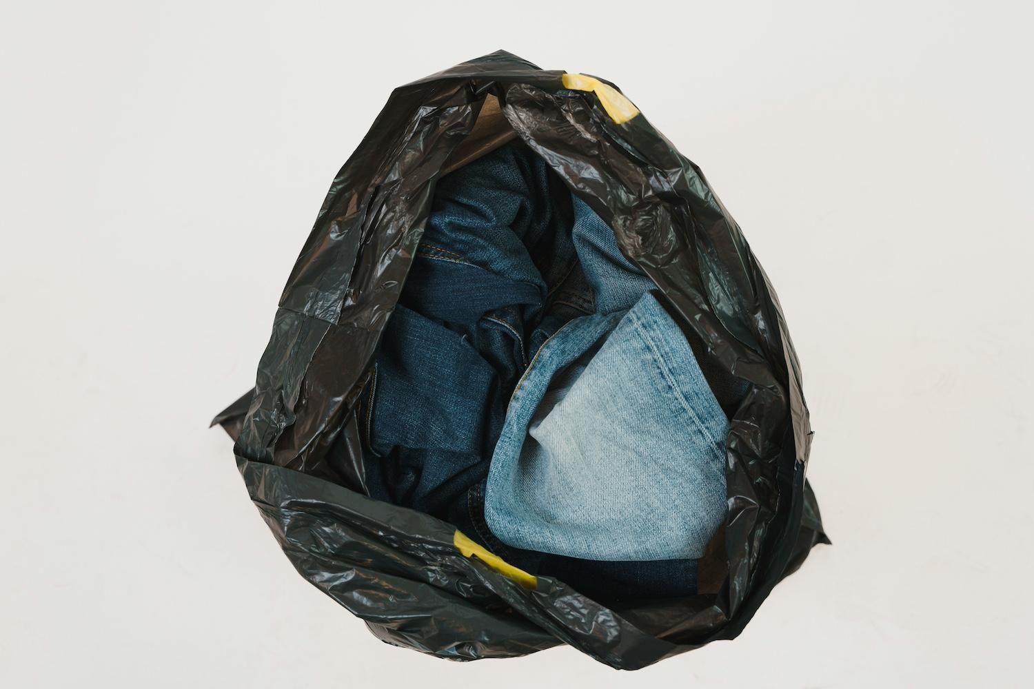 Jeans in a trash bag — repurposed denim 