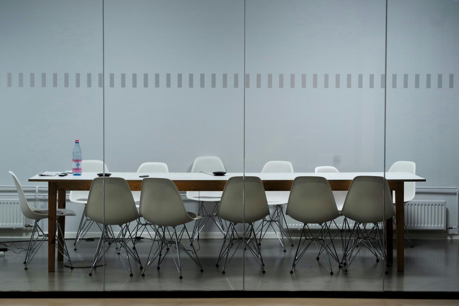 An empty boardroom table — sustainability reporting