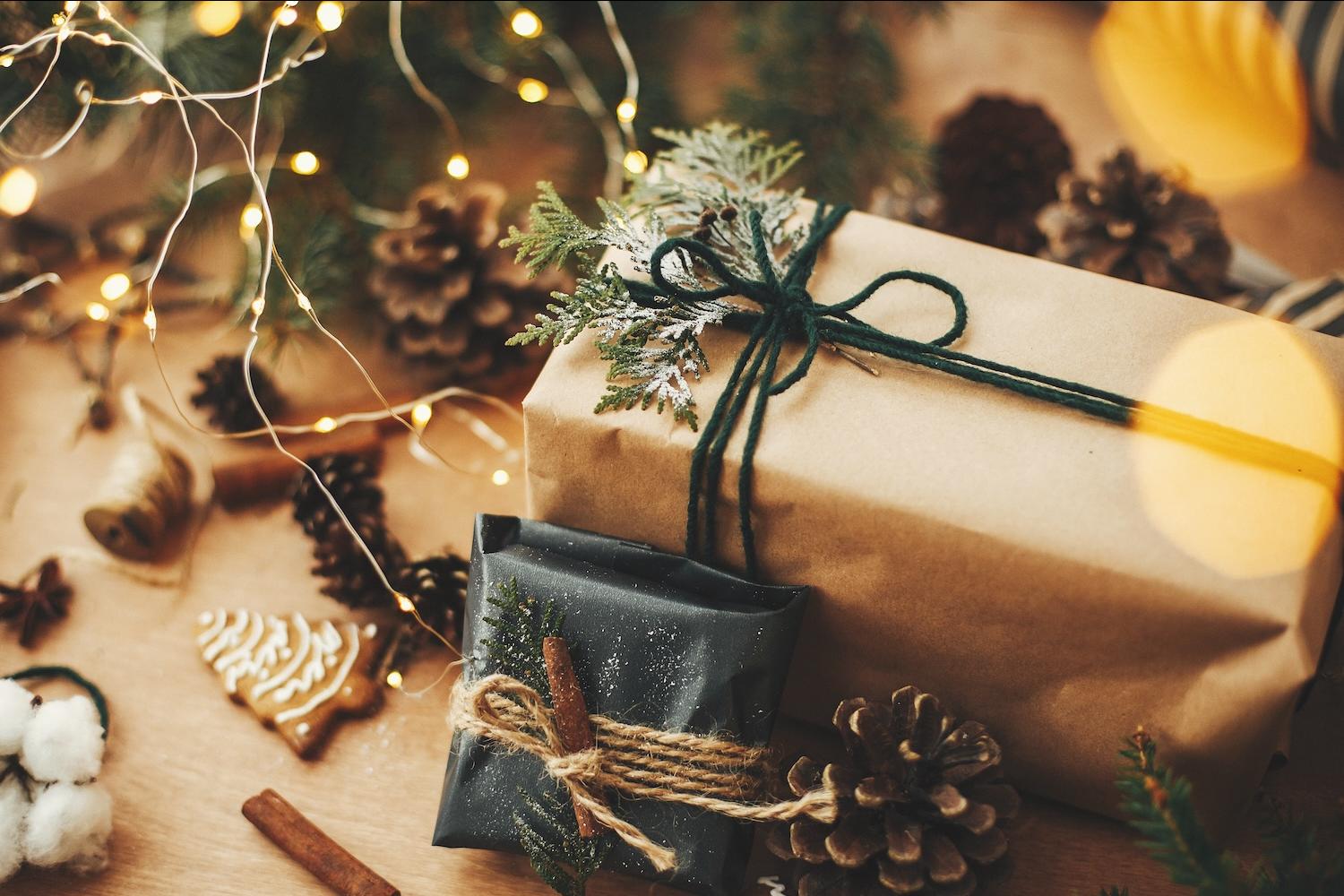 sustainable holiday gifts — gift wrapped in paper with holiday motif 
