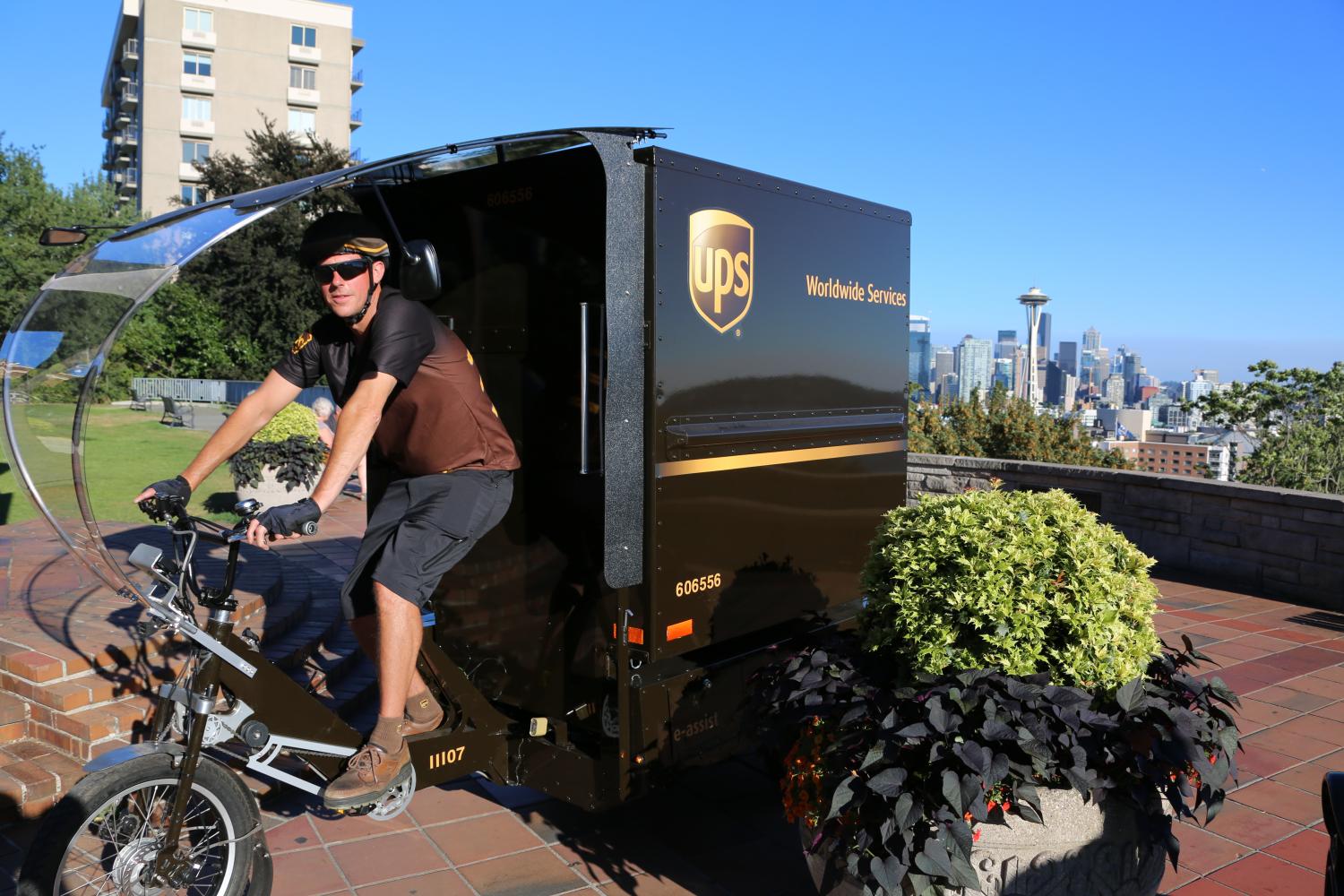 As UPS adds more hybrid and electric vehicles - and even bicycles - as it shifts to a low-carbon fleet, the rattle of the engine you hear as trucks pull up to your house with that coveted package could soon become a thing of the past.