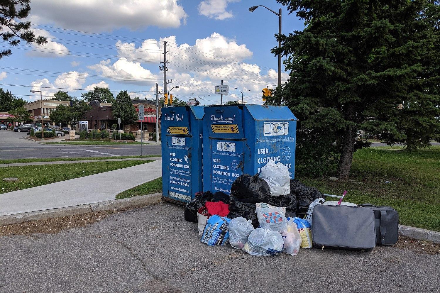 used clothing donation bin outside thrift store