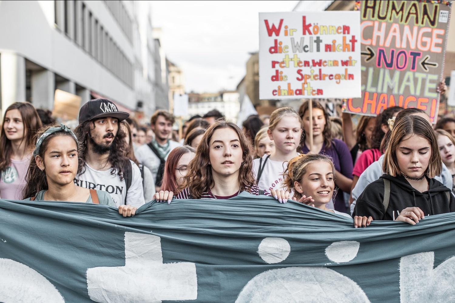 young people at a fridays for future march in support of climate action - how everyday people can counter anti-esg narratives