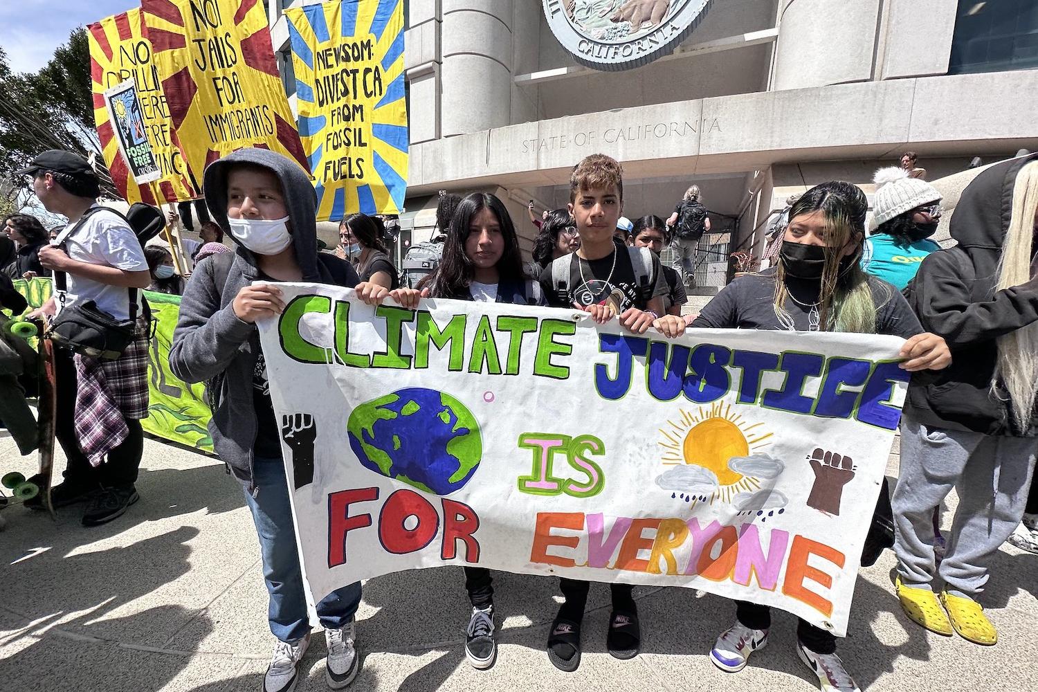 young people rally in front of california statehouse in support of climate justice