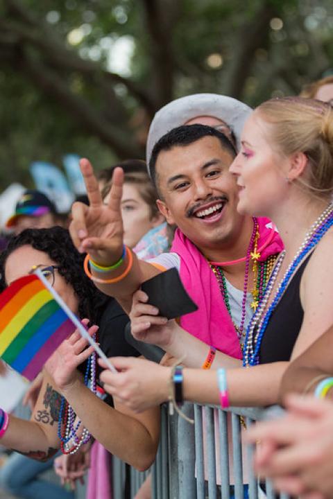 Man gives peace sign at pride parade in st petersburg florida - LGBTQ+ rights