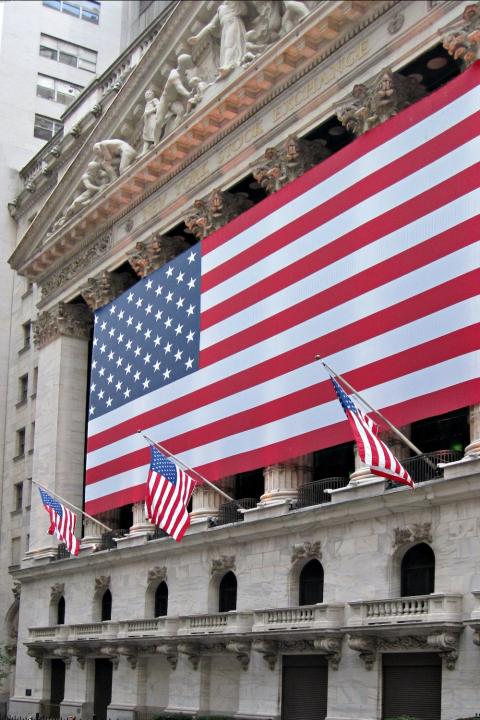 new york stock exchange in new york city with american flags - how is the american public responding to anti-esg anti-woke arguments