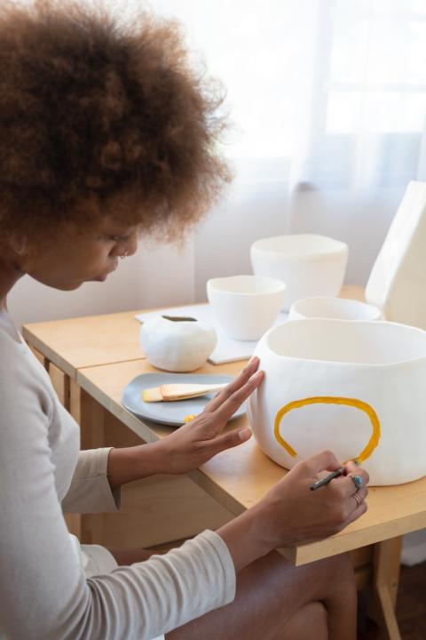 black woman entrepreneur with pottery ceramics business