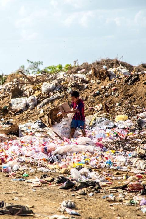 child in a plastic waste dump in nicaragua - Global Plastics Treaty negotiations underway