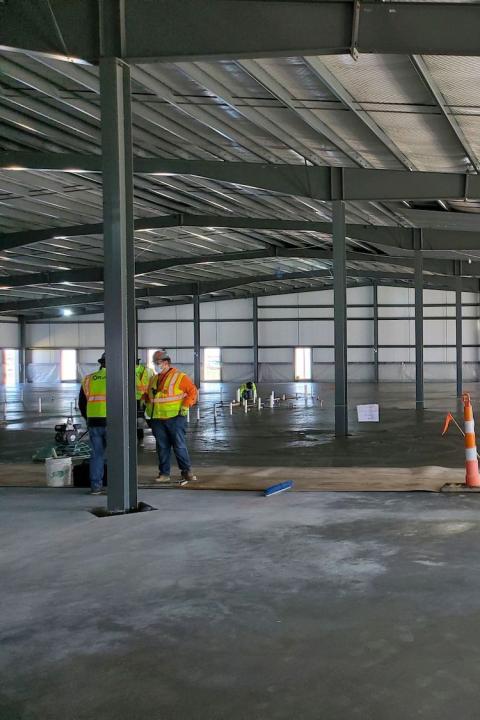 contractors lay low-carbon concrete at Meta data center - sustainability pilot program