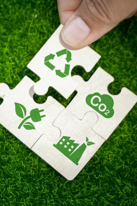 puzzle pieces representing ESG and sustainability - recycling reducing emissions