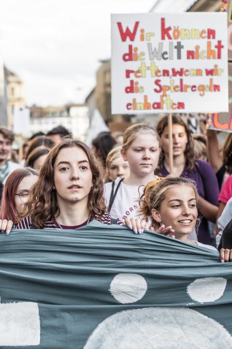 young people at a fridays for future march in support of climate action - how everyday people can counter anti-esg narratives