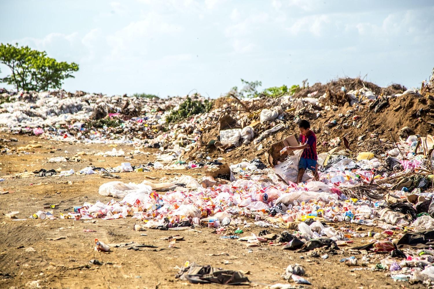 child in a plastic waste dump in nicaragua - Global Plastics Treaty negotiations underway